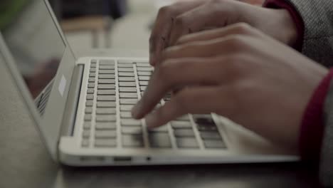 Cropped-shot-of-male-hands-typing-on-laptop-computer